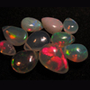 truly very rare - Ethiopian Opal - really - tope grade high quality smooth polished - pear briolett - huge size - 3x5 - 6.5x9 mm approx 10 pcs - each pcs - have amazing - beautifull - flashy fire all around in the stone approx STUNNING QUALITY - VERY VERY RARE